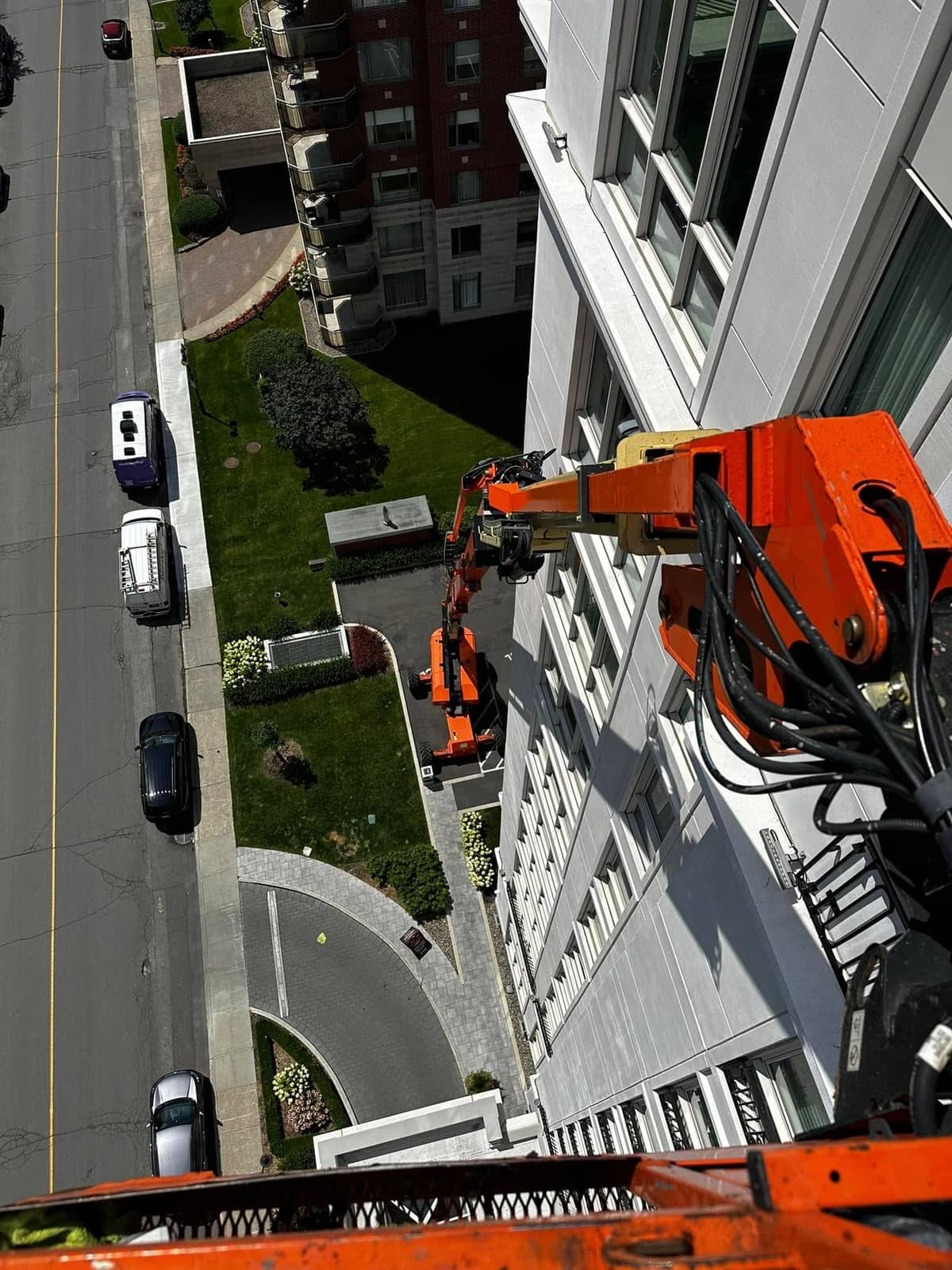Top-down view from a 135-foot boom lift, high-rise window cleaning